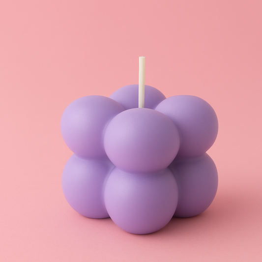 Purple bubble candle on a pink background